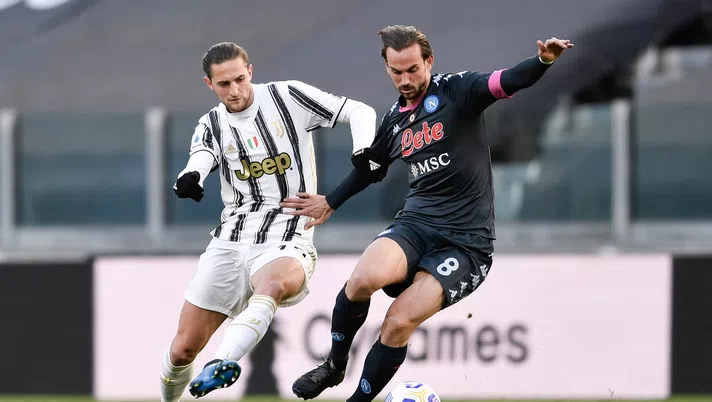 TURIN, ITALY - APRIL 07: Adrien Rabiot of Juventus is challenged by Fabian Ruiz of SSC Napoli during the Serie A match between Juventus and Napoli at Allianz Stadium on April 07, 2021 in Turin, Italy. (Photo by Daniele Badolato - Juventus FC/Juventus FC via Getty Images)