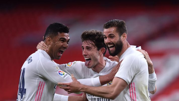 BILBAO, SPAIN - MAY 16: Nacho of Real Madrid celebrates with team mates (L - R) Casemiro and Alvaro Odriozola after scoring their side's first goal during the La Liga Santander match between Athletic Club and Real Madrid at Estadio de San Mames on May 16, 2021 in Bilbao, Spain. Sporting stadiums around Spain remain under strict restrictions due to the Coronavirus Pandemic as Government social distancing laws prohibit fans inside venues resulting in games being played behind closed doors. (Photo by Juan Manuel Serrano Arce/Getty Images) Sky: “Il Milan tratta due giocatori col Real Madrid: Brahim in arrivo e c’è una novità” - immagine 1
