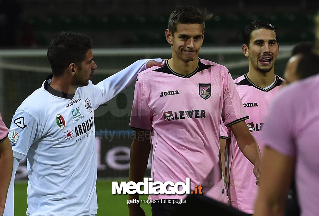  PALERMO, ITALY - NOVEMBER 30: Norman Balogh of Palermo is conforted by Pietro Ceccaroni of Spezia after losing  the TIM Cup match between US Citta di Palermo and AC Spezia at Stadio Renzo Barbera on November 30, 2016 in Palermo, Italy.  (Photo by Tullio M. Puglia/Getty Images) 
