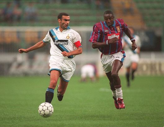 15 SEP 1994: JOHN FASHANU OF ASTON VILLA CHASES FOR THE BALL WITH BERGOMI OF INTER MILAN DURING THE ASTON VILLA V INTER MILAN UEFA CUP FIRST LEG TIE IN THE SAN SIRO STADIUM IN MILAN. Mandatory Credit: Mike Hewitt/ALLSPORT 15 SEP 1994: JOHN FASHANU OF ASTON VILLA CHASES FOR THE BALL WITH BERGOMI OF INTER MILAN DURING THE ASTON VILLA V INTER MILAN UEFA CUP FIRST LEG TIE IN THE SAN SIRO STADIUM IN MILAN. Mandatory Credit: Mike Hewitt/ALLSPORT