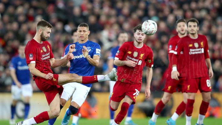 LIVERPOOL, ENGLAND - JANUARY 05: Nathaniel Phillips of Liverpool clears the ball under pressure from Richarlison of Everton during the FA Cup Third Round match between Liverpool and Everton at Anfield on January 05, 2020 in Liverpool, England. (Photo by Clive Brunskill/Getty Images) LIVERPOOL, ENGLAND - JANUARY 05: Nathaniel Phillips of Liverpool clears the ball under pressure from Richarlison of Everton during the FA Cup Third Round match between Liverpool and Everton at Anfield on January 05, 2020 in Liverpool, England. (Photo by Clive Brunskill/Getty Images)