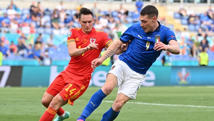 ROME, ITALY - JUNE 20: Andrea Belotti of Italy battles for possession with Connor Roberts of Wales during the UEFA Euro 2020 Championship Group A match between Italy and Wales at Olimpico Stadium on June 20, 2021 in Rome, Italy. (Photo by Andreas Solaro - Pool/Getty Images) 