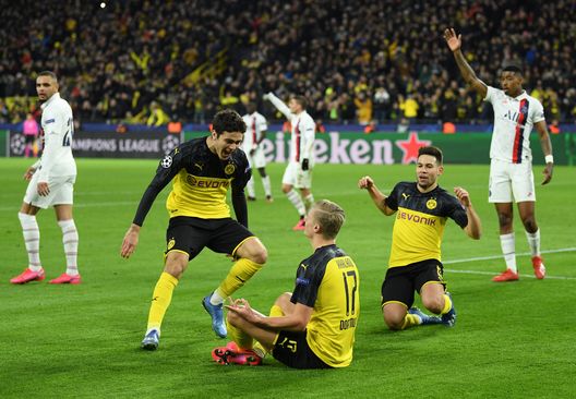 DORTMUND, GERMANY - FEBRUARY 18: Erling Haaland of Borussia Dortmund celebrates with Gio Reyna and Raphael Guerreiro after scoring his team's first goal during the UEFA Champions League round of 16 first leg match between Borussia Dortmund and Paris Saint-Germain at Signal Iduna Park on February 18, 2020 in Dortmund, Germany. (Photo by Stuart Franklin/Bongarts/Getty Images) DORTMUND, GERMANY - FEBRUARY 18: Erling Haaland of Borussia Dortmund celebrates with Gio Reyna and Raphael Guerreiro after scoring his team's first goal during the UEFA Champions League round of 16 first leg match between Borussia Dortmund and Paris Saint-Germain at Signal Iduna Park on February 18, 2020 in Dortmund, Germany. (Photo by Stuart Franklin/Bongarts/Getty Images)