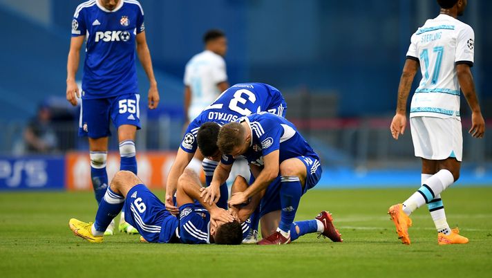 ZAGREB, CROATIA - SEPTEMBER 06: Bruno Petkovic celebrates with Stefan Ristovski and Josip Sutalo after Mislav Orsic of Dinamo Zagreb (not pictured) scored their sides first goal during the UEFA Champions League group E match between Dinamo Zagreb and Chelsea FC at Stadion Maksimir on September 06, 2022 in Zagreb, Croatia. (Photo by Jurij Kodrun/Getty Images) ZAGREB, CROATIA - SEPTEMBER 06: Bruno Petkovic celebrates with Stefan Ristovski and Josip Sutalo after Mislav Orsic of Dinamo Zagreb (not pictured) scored their sides first goal during the UEFA Champions League group E match between Dinamo Zagreb and Chelsea FC at Stadion Maksimir on September 06, 2022 in Zagreb, Croatia. (Photo by Jurij Kodrun/Getty Images)