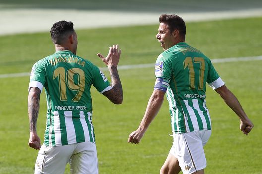SEVILLE, SPAIN - NOVEMBER 01: Antonio Sanabria of Real Betis celebrates with teammate Joaquin after scoring his team's first goal during the La Liga Santander match between Real Betis and Elche CF at Estadio Benito Villamarin on November 01, 2020 in Seville, Spain. Football Stadiums around Europe remain empty due to the Coronavirus Pandemic as Government social distancing laws prohibit fans inside venues resulting in fixtures being played behind closed doors. (Photo by Fran Santiago/Getty Images) SEVILLE, SPAIN - NOVEMBER 01: Antonio Sanabria of Real Betis celebrates with teammate Joaquin after scoring his team's first goal during the La Liga Santander match between Real Betis and Elche CF at Estadio Benito Villamarin on November 01, 2020 in Seville, Spain. Football Stadiums around Europe remain empty due to the Coronavirus Pandemic as Government social distancing laws prohibit fans inside venues resulting in fixtures being played behind closed doors. (Photo by Fran Santiago/Getty Images)