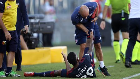 CAGLIARI, ITALY - SEPTEMBER 12: Dalbert of Cagliari is injured during the Serie A match between Cagliari Calcio and Genoa CFC at Sardegna Arena on September 12, 2021 in Cagliari, Italy. (Photo by Enrico Locci/Getty Images)