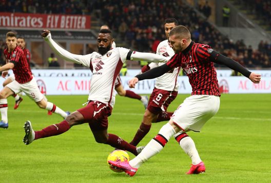 MILAN, ITALY - JANUARY 28: Ante Rebic (R) of AC Milan is challenged by Nicolas Nkoulou (L) of Torino during the Coppa Italia Quarter Final match between AC Milan and Torino at San Siro on January 28, 2020 in Milan, Italy. (Photo by Marco Luzzani/Getty Images) 