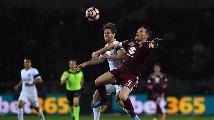 TURIN, ITALY - MARCH 18:  Andrea Belotti (R) of FC Torino clashes with Cristian Ansaldi of FC Internazionale during the Serie A match between FC Torino and FC Internazionale at Stadio Olimpico di Torino on March 18, 2017 in Turin, Italy.  (Photo by Valerio Pennicino/Getty Images) 