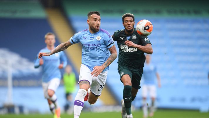 MANCHESTER, ENGLAND - JULY 08: Nicolas Otamendi of Manchester City battles for possession with Joelinton of Newcastle United during the Premier League match between Manchester City and Newcastle United at Etihad Stadium on July 08, 2020 in Manchester, England. Football Stadiums around Europe remain empty due to the Coronavirus Pandemic as Government social distancing laws prohibit fans inside venues resulting in all fixtures being played behind closed doors. (Photo by Michael Regan/Getty Images) MANCHESTER, ENGLAND - JULY 08: Nicolas Otamendi of Manchester City battles for possession with Joelinton of Newcastle United during the Premier League match between Manchester City and Newcastle United at Etihad Stadium on July 08, 2020 in Manchester, England. Football Stadiums around Europe remain empty due to the Coronavirus Pandemic as Government social distancing laws prohibit fans inside venues resulting in all fixtures being played behind closed doors. (Photo by Michael Regan/Getty Images)
