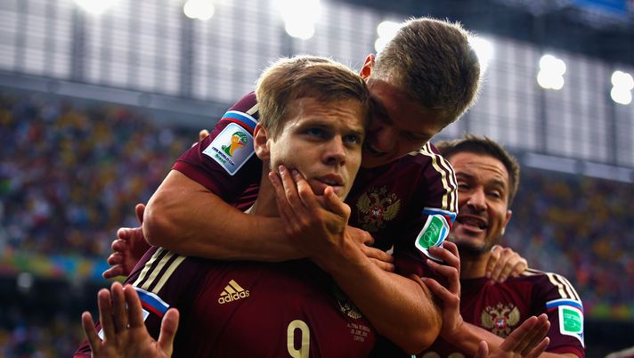 CURITIBA, BRAZIL - JUNE 26: Alexander Kokorin of Russia celebrates scoring his team's first goal with teammate Oleg Shatov on his back during the 2014 FIFA World Cup Brazil Group H match between Algeria and Russia at Arena da Baixada on June 26, 2014 in Curitiba, Brazil. (Photo by Clive Rose/Getty Images) CURITIBA, BRAZIL - JUNE 26: Alexander Kokorin of Russia celebrates scoring his team's first goal with teammate Oleg Shatov on his back during the 2014 FIFA World Cup Brazil Group H match between Algeria and Russia at Arena da Baixada on June 26, 2014 in Curitiba, Brazil. (Photo by Clive Rose/Getty Images)