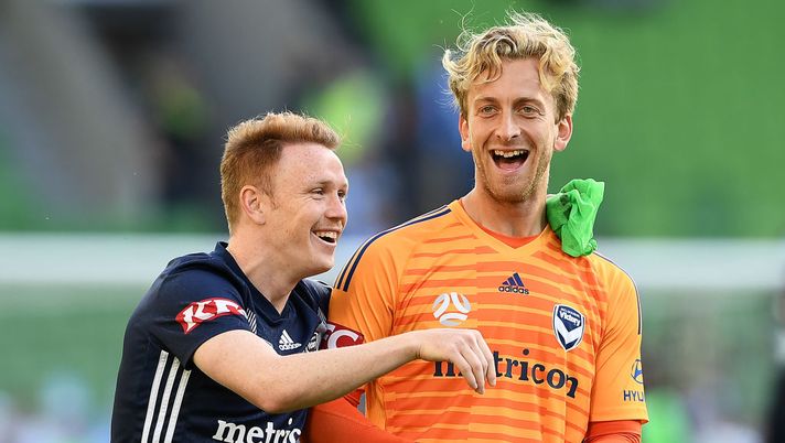MELBOURNE, AUSTRALIA - DECEMBER 21: Corey Brown and Victory goalkeeper Lawrence Thomas celebrate winning the round 11 A-League match between Melbourne City and Melbourne Victory at AAMI Park on December 21, 2019 in Melbourne, Australia. (Photo by Quinn Rooney/Getty Images) 
