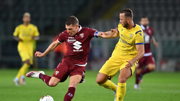 TURIN, ITALY - JULY 22:  Andrea Belotti of Torino FC is challenged by Amir Rrahmani of Hellas Verona during the Serie A match between Torino FC and  Hellas Verona at Stadio Olimpico di Torino on July 22, 2020 in Turin, Italy.  (Photo by Valerio Pennicino/Getty Images) 