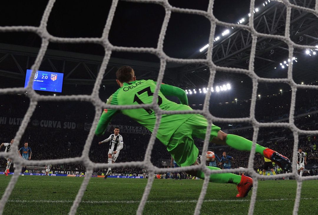  TURIN, ITALY - MARCH 12: Cristiano Ronaldo of Juventus scores  a penalty (3-0) during the UEFA Champions League Round of 16 Second Leg match between Juventus and Club de Atletico Madrid at Allianz Stadium on March 12, 2019 in Turin, . (Photo by Tullio M. Puglia/Getty Images) 