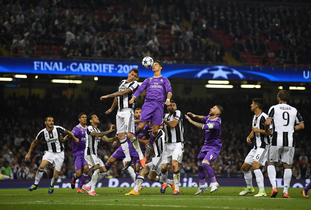  CARDIFF, WALES - JUNE 03: Mario Mandzukic of Juventus and Cristiano Ronaldo of Real Madrid battle to win a header during the UEFA Champions League Final between Juventus and Real Madrid at National Stadium of Wales on June 3, 2017 in Cardiff, Wales.  (Photo by Laurence Griffiths/Getty Images) 