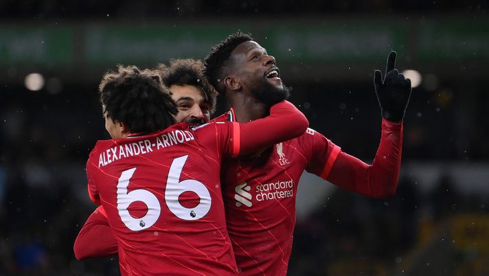 WOLVERHAMPTON, ENGLAND - DECEMBER 04: Divock Origi of Liverpool celebrates with Trent Alexander-Arnold and Mohamed Salah after scoring their side's first goal during the Premier League match between Wolverhampton Wanderers and Liverpool at Molineux on December 04, 2021 in Wolverhampton, England. (Photo by Laurence Griffiths/Getty Images) WOLVERHAMPTON, ENGLAND - DECEMBER 04: Divock Origi of Liverpool celebrates with Trent Alexander-Arnold and Mohamed Salah after scoring their side's first goal during the Premier League match between Wolverhampton Wanderers and Liverpool at Molineux on December 04, 2021 in Wolverhampton, England. (Photo by Laurence Griffiths/Getty Images)