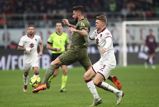 MILAN, ITALY - FEBRUARY 10: Olivier Giroud of AC Milan is challenged by Perr Schuurs of Torino during the Serie A match between AC MIlan and Torino FC at Stadio Giuseppe Meazza on February 10, 2023 in Milan, . (Photo by Marco Luzzani/Getty Images)