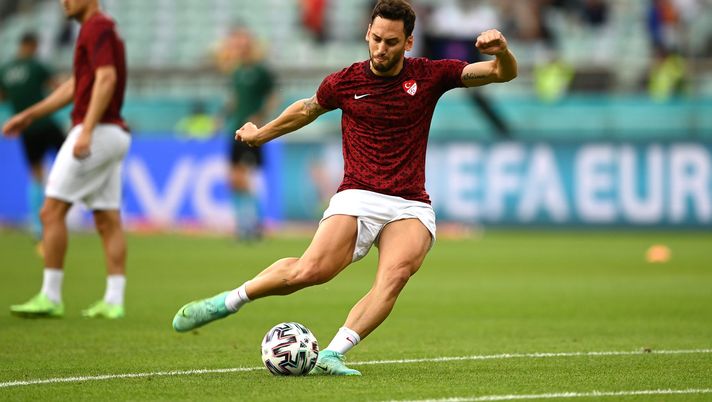 BAKU, AZERBAIJAN - JUNE 20: Hakan Calhanoglu of Turkey shoots during the warm up prior to the UEFA Euro 2020 Championship Group A match between Switzerland and Turkey at Baku Olimpiya Stadionu on June 20, 2021 in Baku, Azerbaijan. (Photo by Ozan Kose - Pool/Getty Images) BAKU, AZERBAIJAN - JUNE 20: Hakan Calhanoglu of Turkey shoots during the warm up prior to the UEFA Euro 2020 Championship Group A match between Switzerland and Turkey at Baku Olimpiya Stadionu on June 20, 2021 in Baku, Azerbaijan. (Photo by Ozan Kose - Pool/Getty Images)