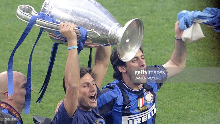 Inter Milan's Argentinian defender and captain Javier Aldemar Zanetti (L) and Inter Milan's Argentinian forward Alberto Milito (R) show the Champions League Trophy to their supporters at San Siro stadium in Milan after their team's victory against Bayern Munich in the UEFA Champions league final football match on May 23, 2010. Inter beat Bayern Munich 2-0 to add the European title to their Serie A and domestic cup triumphs allowing Inter Milan's Portuguese coach Jose Mourinho to become just the third coach to win the continental crown with two different teams. AFP PHOTO DAMIEN MEYER (Photo credit should read DAMIEN MEYER/AFP/Getty Images) Inter Milan's Argentinian defender and captain Javier Aldemar Zanetti (L) and Inter Milan's Argentinian forward Alberto Milito (R) show the Champions League Trophy to their supporters at San Siro stadium in Milan after their team's victory against Bayern Munich in the UEFA Champions league final football match on May 23, 2010. Inter beat Bayern Munich 2-0 to add the European title to their Serie A and domestic cup triumphs allowing Inter Milan's Portuguese coach Jose Mourinho to become just the third coach to win the continental crown with two different teams. AFP PHOTO DAMIEN MEYER (Photo credit should read DAMIEN MEYER/AFP/Getty Images)