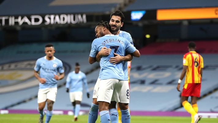 MANCHESTER, ENGLAND - DECEMBER 15: Ilkay Guendogan of Manchester City celebrates with teammate Raheem Sterling after scoring their team's first goal during the Premier League match between Manchester City and West Bromwich Albion at Etihad Stadium on December 15, 2020 in Manchester, England. The match will be played without fans, behind closed doors as a Covid-19 precaution. (Photo by Martin Rickett - Pool/Getty Images) MANCHESTER, ENGLAND - DECEMBER 15: Ilkay Guendogan of Manchester City celebrates with teammate Raheem Sterling after scoring their team's first goal during the Premier League match between Manchester City and West Bromwich Albion at Etihad Stadium on December 15, 2020 in Manchester, England. The match will be played without fans, behind closed doors as a Covid-19 precaution. (Photo by Martin Rickett - Pool/Getty Images)
