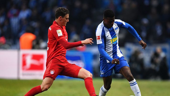 BERLIN, GERMANY - JANUARY 19: Javairô Dilrosun of Hertha Berlin 
 looks to break past Benjamin Pavard of BFC Bayern Muenchen during the Bundesliga match between Hertha BSC and FC Bayern Muenchen at Olympiastadion on January 19, 2020 in Berlin, Germany. (Photo by Stuart Franklin/Bongarts/Getty Images) 
