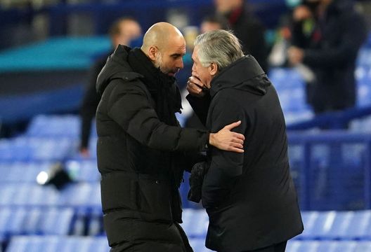 LIVERPOOL, ENGLAND - FEBRUARY 17: Pep Guardiola, Manager of Manchester City interacts with Carlo Ancelotti, Manager of Everton prior to the Premier League match between Everton and Manchester City at Goodison Park on February 17, 2021 in Liverpool, England. Sporting stadiums around the UK remain under strict restrictions due to the Coronavirus Pandemic as Government social distancing laws prohibit fans inside venues resulting in games being played behind closed doors. (Photo by Jon Super - Pool/Getty Images) LIVERPOOL, ENGLAND - FEBRUARY 17: Pep Guardiola, Manager of Manchester City interacts with Carlo Ancelotti, Manager of Everton prior to the Premier League match between Everton and Manchester City at Goodison Park on February 17, 2021 in Liverpool, England. Sporting stadiums around the UK remain under strict restrictions due to the Coronavirus Pandemic as Government social distancing laws prohibit fans inside venues resulting in games being played behind closed doors. (Photo by Jon Super - Pool/Getty Images)