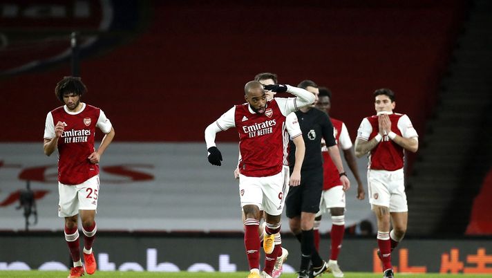 LONDON, ENGLAND - DECEMBER 26: Alexandre Lacazette of Arsenal celebrates after scoring his team's first goal during the Premier League match between Arsenal and Chelsea at Emirates Stadium on December 26, 2020 in London, England. The match will be played without fans, behind closed doors as a Covid-19 precaution. (Photo by Andrew Boyers - Pool/Getty Images) LONDON, ENGLAND - DECEMBER 26: Alexandre Lacazette of Arsenal celebrates after scoring his team's first goal during the Premier League match between Arsenal and Chelsea at Emirates Stadium on December 26, 2020 in London, England. The match will be played without fans, behind closed doors as a Covid-19 precaution. (Photo by Andrew Boyers - Pool/Getty Images)