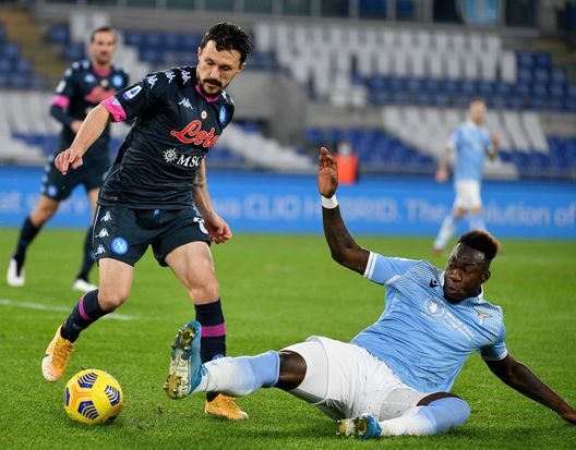 ROME, ITALY - DECEMBER 20: Mario Rui of SSC Napoli compte for the ball with Felipe Caicedo of SS Lazio during the Serie A match between SS Lazio and SSC Napoli at Stadio Olimpico on December 20, 2020 in Rome, Italy. Sporting stadiums around Italy remain under strict restrictions due to the Coronavirus Pandemic as Government social distancing laws prohibit fans inside venues resulting in games being played behind closed doors. (Photo by Marco Rosi - SS Lazio/Getty Images) ROME, ITALY - DECEMBER 20: Mario Rui of SSC Napoli compte for the ball with Felipe Caicedo of SS Lazio during the Serie A match between SS Lazio and SSC Napoli at Stadio Olimpico on December 20, 2020 in Rome, Italy. Sporting stadiums around Italy remain under strict restrictions due to the Coronavirus Pandemic as Government social distancing laws prohibit fans inside venues resulting in games being played behind closed doors. (Photo by Marco Rosi - SS Lazio/Getty Images)
