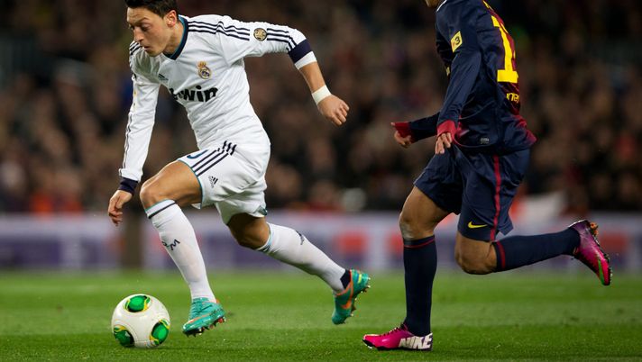 BARCELONA, SPAIN - FEBRUARY 26: Mesut Ozil (L) of Real Madrid runs with the ball besides Pedro Rodriguez of Barcelona during the Copa del Rey semi final second leg match between FC Barcelona and Real Madrid CF at the Camp Nou on February 26, 2013 in Barcelona, Spain. (Photo by Jasper Juinen/Getty Images) BARCELONA, SPAIN - FEBRUARY 26: Mesut Ozil (L) of Real Madrid runs with the ball besides Pedro Rodriguez of Barcelona during the Copa del Rey semi final second leg match between FC Barcelona and Real Madrid CF at the Camp Nou on February 26, 2013 in Barcelona, Spain. (Photo by Jasper Juinen/Getty Images)