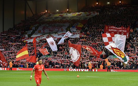 LIVERPOOL, ENGLAND - OCTOBER 25:  (THE SUN OUT, THE SUN ON SUNDAY OUT) Fans wave flags in The Kop before the Barclays Premier League match between Liverpool and Southampton at Anfield on October 25, 2015 in Liverpool, England.  (Photo by Andrew Powell/Liverpool FC via Getty Images) 