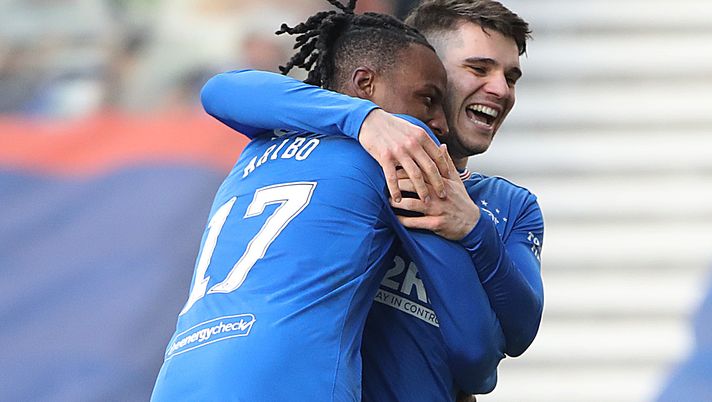 GLASGOW, SCOTLAND - FEBRUARY 21: Joe Aribo of Ranger celebrates with Ianis Hagi of Rangers after he scores his sides third goal during the Ladbrokes Scottish Premier League match between Rangers and Dundee United at Ibrox Stadium on February 21, 2021 in Glasgow, Scotland. Sporting stadiums around the UK remain under strict restrictions due to the Coronavirus Pandemic as Government social distancing laws prohibit fans inside venues resulting in games being played behind closed doors. (Photo by Ian MacNicol/Getty Images) GLASGOW, SCOTLAND - FEBRUARY 21: Joe Aribo of Ranger celebrates with Ianis Hagi of Rangers after he scores his sides third goal during the Ladbrokes Scottish Premier League match between Rangers and Dundee United at Ibrox Stadium on February 21, 2021 in Glasgow, Scotland. Sporting stadiums around the UK remain under strict restrictions due to the Coronavirus Pandemic as Government social distancing laws prohibit fans inside venues resulting in games being played behind closed doors. (Photo by Ian MacNicol/Getty Images)