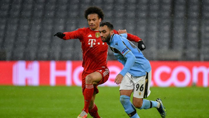 MUNICH, GERMANY - MARCH 17: Mohamed Fares of SS Lazio fights for the ball against Leroy Sane of Bayern München during the UEFA Champions League Round of 16 match between Bayern München and SS Lazio at Allianz Arena on March 17, 2021 in Munich, Germany. (Photo by Marco Rosi - SS Lazio/Getty Images) 