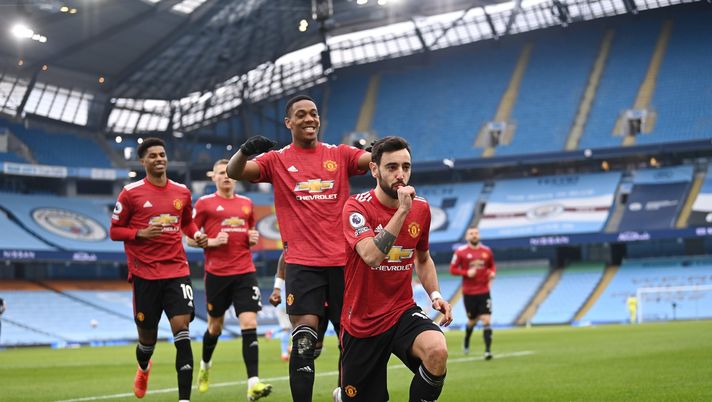 MANCHESTER, ENGLAND - MARCH 07: Bruno Fernandes of Manchester United celebrates scoring the first goal from a penalty during the Premier League match between Manchester City and Manchester United at Etihad Stadium on March 07, 2021 in Manchester, England. Sporting stadiums around the UK remain under strict restrictions due to the Coronavirus Pandemic as Government social distancing laws prohibit fans inside venues resulting in games being played behind closed doors. (Photo by Laurence Griffiths/Getty Images) Manchester United
