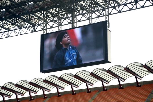 MILAN, ITALY - NOVEMBER 29: A tribute is seen on the LED board in memory of former footballer, Diego Maradona, who recently passed away prior to the Serie A match between AC Milan and ACF Fiorentina at Stadio Giuseppe Meazza on November 29, 2020 in Milan, Italy. Sporting stadiums around Italy remain under strict restrictions due to the Coronavirus Pandemic as Government social distancing laws prohibit fans inside venues resulting in games being played behind closed doors. (Photo by Marco Luzzani/Getty Images) MILAN, ITALY - NOVEMBER 29: A tribute is seen on the LED board in memory of former footballer, Diego Maradona, who recently passed away prior to the Serie A match between AC Milan and ACF Fiorentina at Stadio Giuseppe Meazza on November 29, 2020 in Milan, Italy. Sporting stadiums around Italy remain under strict restrictions due to the Coronavirus Pandemic as Government social distancing laws prohibit fans inside venues resulting in games being played behind closed doors. (Photo by Marco Luzzani/Getty Images)