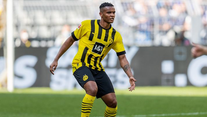 DORTMUND, GERMANY - MAY 14: Manuel Akanji of Borussia Dortmund runs with the ball during the Bundesliga match between Borussia Dortmund and Hertha BSC at Signal Iduna Park on May 14, 2022 in Dortmund, Germany. (Photo by Boris Streubel/Getty Images)  Bundesliga