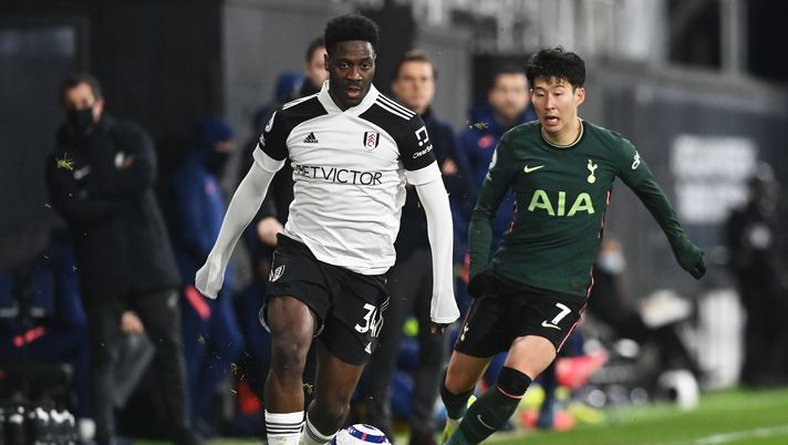 LONDON, ENGLAND - MARCH 04: Ola Aina of Fulham on the ball whilst under pressure from Son Heung-Min of Tottenham Hotspur during the Premier League match between Fulham and Tottenham Hotspur at Craven Cottage on March 04, 2021 in London, England. Sporting stadiums around the UK remain under strict restrictions due to the Coronavirus Pandemic as Government social distancing laws prohibit fans inside venues resulting in games being played behind closed doors. (Photo by Neil Hall - Pool/Getty Images) LONDON, ENGLAND - MARCH 04: Ola Aina of Fulham on the ball whilst under pressure from Son Heung-Min of Tottenham Hotspur during the Premier League match between Fulham and Tottenham Hotspur at Craven Cottage on March 04, 2021 in London, England. Sporting stadiums around the UK remain under strict restrictions due to the Coronavirus Pandemic as Government social distancing laws prohibit fans inside venues resulting in games being played behind closed doors. (Photo by Neil Hall - Pool/Getty Images)