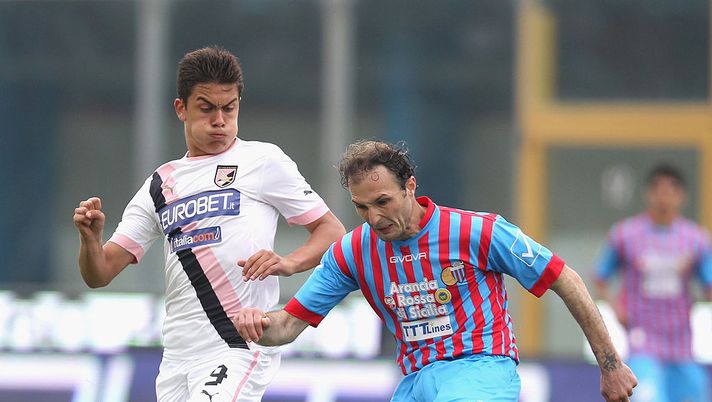 CATANIA, ITALY - APRIL 21: Giovanni Marchese (R) of Catania competes for the ball with Paulo Dybala of Palermo during the Serie A match between Calcio Catania and US Citta di Palermo at Stadio Angelo Massimino on April 21, 2013 in Catania, Italy. (Photo by Maurizio Lagana/Getty Images) CATANIA, ITALY - APRIL 21: Giovanni Marchese (R) of Catania competes for the ball with Paulo Dybala of Palermo during the Serie A match between Calcio Catania and US Citta di Palermo at Stadio Angelo Massimino on April 21, 2013 in Catania, Italy. (Photo by Maurizio Lagana/Getty Images)