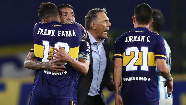 BUENOS AIRES, ARGENTINA - DECEMBER 23: Miguel Angel Russo head coach of Boca Juniors celebrates with his players Carlos Tevez and Frank Fabra after winning a quarter final second leg match of Copa CONMEBOL Libertadores 2020 between Boca Juniors and Racing Club at Estadio Alberto J. Armando on December 23, 2020 in Buenos Aires, Argentina. (Photo by Agustin Marcarian-Pool/Getty Images) BUENOS AIRES, ARGENTINA - DECEMBER 23: Miguel Angel Russo head coach of Boca Juniors celebrates with his players Carlos Tevez and Frank Fabra after winning a quarter final second leg match of Copa CONMEBOL Libertadores 2020 between Boca Juniors and Racing Club at Estadio Alberto J. Armando on December 23, 2020 in Buenos Aires, Argentina. (Photo by Agustin Marcarian-Pool/Getty Images)