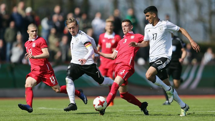 KELSTERBACH, GERMANY - MARCH 25: Aleksa Terzic (C) of Serbia is challenged by Tobias Warschewski (R) and Felix Passlack of Germany during the UEFA Elite Round match between U19 Germany and U19 Serbia at Sportpark on March 25, 2017 in Kelsterbach, Germany. (Photo by Alex Grimm/Bongarts/Getty Images) KELSTERBACH, GERMANY - MARCH 25: Aleksa Terzic (C) of Serbia is challenged by Tobias Warschewski (R) and Felix Passlack of Germany during the UEFA Elite Round match between U19 Germany and U19 Serbia at Sportpark on March 25, 2017 in Kelsterbach, Germany. (Photo by Alex Grimm/Bongarts/Getty Images)