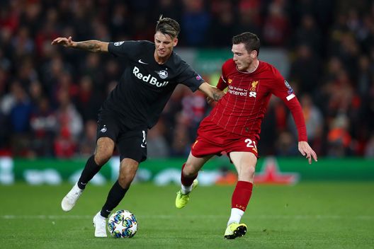 LIVERPOOL, ENGLAND - OCTOBER 02: Andy Robertson of Liverpool anc Dominik Szoboszlai of Red Bull Salzburg during the UEFA Champions League group E match between Liverpool FC and RB Salzburg at Anfield on October 02, 2019 in Liverpool, United Kingdom. (Photo by Clive Brunskill/Getty Images) 