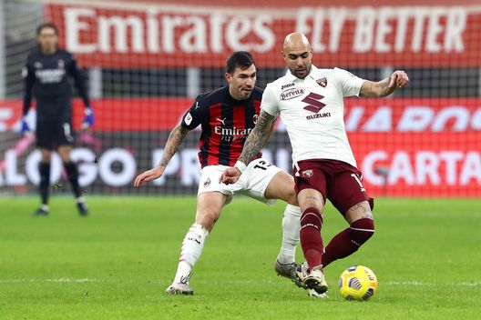  MILAN, ITALY - JANUARY 12: Simone Zaza of Torino F.C. is challenged by Riccardo Tonin of A.C. Milan during the Coppa Italia match between AC Milan and Torino FC at Stadio Giuseppe Meazza on January 12, 2021 in Milan, Italy. Sporting stadiums around Italy remain under strict restrictions due to the Coronavirus Pandemic as Government social distancing laws prohibit fans inside venues resulting in games being played behind closed doors. (Photo by Marco Luzzani/Getty Images) 