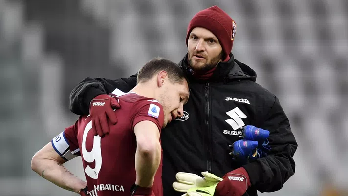 TURIN, ITALY - FEBRUARY 13: Andrea Belotti and Samir Ujkani of Torino FC speak following the Serie A match between Torino FC  and Genoa CFC at Stadio Olimpico di Torino on February 13, 2021 in Turin, Italy. Sporting stadiums around Italy remain under strict restrictions due to the Coronavirus Pandemic as Government social distancing laws prohibit fans inside venues resulting in games being played behind closed doors. (Photo by Valerio Pennicino/Getty Images)