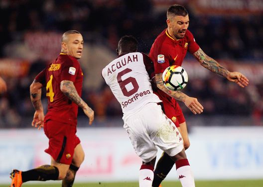  ROME, ITALY - MARCH 09: Aleksandar Kolarov of AS Roma competes for the ball with Afryie Acquah of Torino FC during the Serie A match between AS Roma and Torino FC at Stadio Olimpico on March 9, 2018 in Rome, Italy. (Photo by Paolo Bruno/Getty Images) 