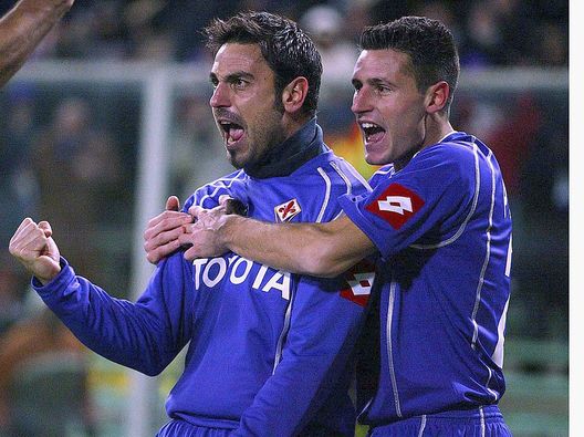 FLORENCE, ITALY - DECEMBER 10: Stefano Fiore (L) and Manuel Pasqual of Fiorentina celebrate Fiore's goal during the Serie A match between Fiorentina and Treviso at the Stadio Artemio Franchi on December 10, 2005 in Florence, Italy. (Photo by New Press/Getty Images) 