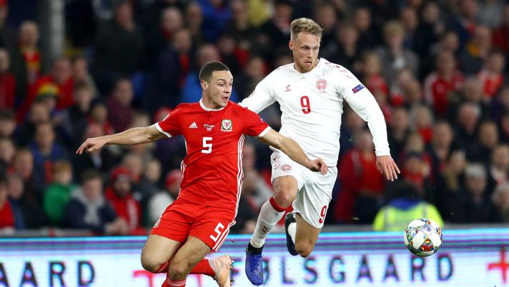CARDIFF, WALES - NOVEMBER 16:  James Chester of Wales is challenged by Nicolai Jorgensen of Denmark during the UEFA Nations League Group B match between Wales and Denmark at Cardiff City Stadium on November 16, 2018 in Cardiff, United Kingdom.  (Photo by Michael Steele/Getty Images) 