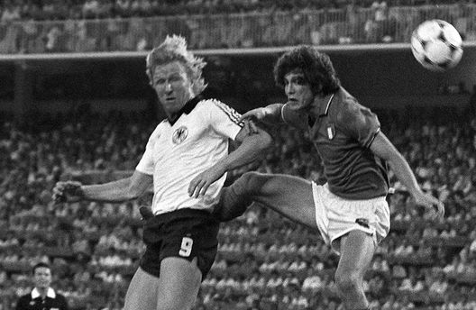 MADRID, SPAIN: West German forward Horst Hrubesch (L) heads the ball in front of Italian defender Fulvio Collovati during the World Cup final between West Germany and Italy 11 July 1982 in Madrid. Italy beat West Germany 3-1 to capture its third World title (1934, 1938, 1982). AFP PHOTO (Photo credit should read ROBERT DELVAC/AFP/Getty Images) MADRID, SPAIN: West German forward Horst Hrubesch (L) heads the ball in front of Italian defender Fulvio Collovati during the World Cup final between West Germany and Italy 11 July 1982 in Madrid. Italy beat West Germany 3-1 to capture its third World title (1934, 1938, 1982). AFP PHOTO (Photo credit should read ROBERT DELVAC/AFP/Getty Images)
