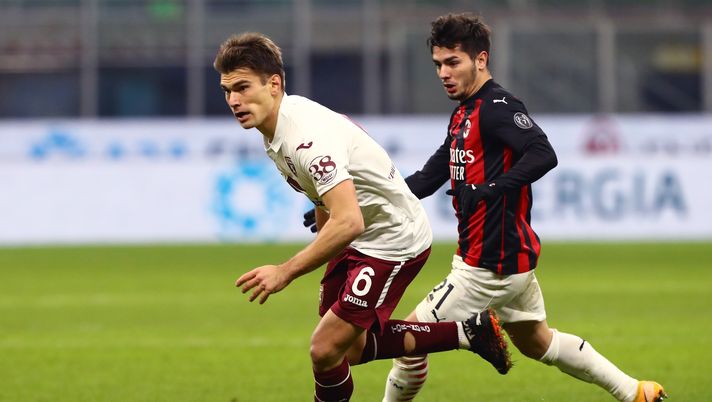 MILAN, ITALY - JANUARY 12: Jacopo Segre of Torino F.C. is challenged by Brahim Diaz of A.C. Milan during the Coppa Italia match between AC Milan and Torino FC at Stadio Giuseppe Meazza on January 12, 2021 in Milan, Italy. Sporting stadiums around Italy remain under strict restrictions due to the Coronavirus Pandemic as Government social distancing laws prohibit fans inside venues resulting in games being played behind closed doors. (Photo by Marco Luzzani/Getty Images) MILAN, ITALY - JANUARY 12: Jacopo Segre of Torino F.C. is challenged by Brahim Diaz of A.C. Milan during the Coppa Italia match between AC Milan and Torino FC at Stadio Giuseppe Meazza on January 12, 2021 in Milan, Italy. Sporting stadiums around Italy remain under strict restrictions due to the Coronavirus Pandemic as Government social distancing laws prohibit fans inside venues resulting in games being played behind closed doors. (Photo by Marco Luzzani/Getty Images)