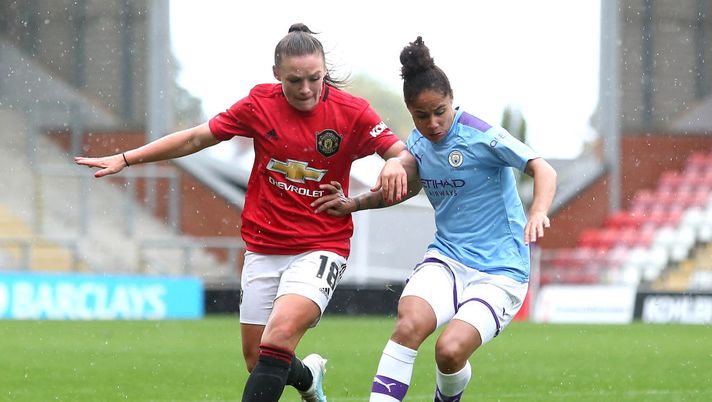 LEIGH, ENGLAND - OCTOBER 20: Demi Stokes of Manchester City Women is challenged by Kirsty Hanson of Manchester United Women during the FA Women's Continental League Cup match between Manchester United Women and Manchester City Women at Leigh Sports Village on October 20, 2019 in Leigh, England. (Photo by Charlotte Tattersall/Getty Images) LEIGH, ENGLAND - OCTOBER 20: Demi Stokes of Manchester City Women is challenged by Kirsty Hanson of Manchester United Women during the FA Women's Continental League Cup match between Manchester United Women and Manchester City Women at Leigh Sports Village on October 20, 2019 in Leigh, England. (Photo by Charlotte Tattersall/Getty Images)