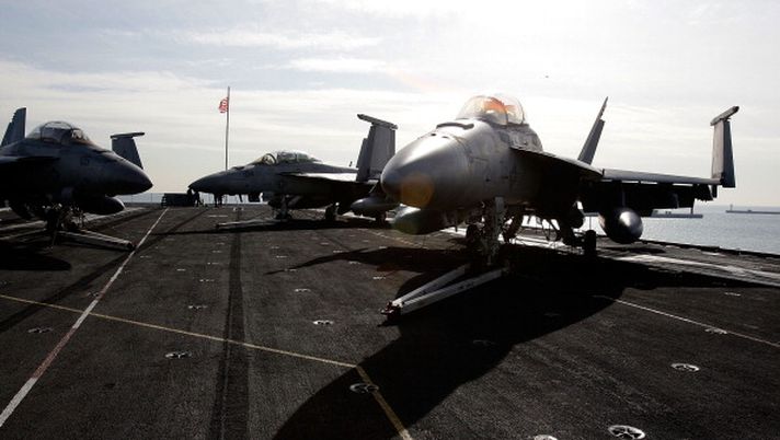 BUSAN, SOUTH KOREA - JANUARY 11: An F 18 Super Hornet aircraft on the flight deck of Aircraft Carrier USS Carl Vinson whilst at anchor in Busan port on January 11, 2011 in Busan. The USS Carl Vinson arrived in South Korea after participating in drills in East China Sea with Japan aimed at deterring possible attacks by North Korea and China. Tensions remain high in the Korean Peninsula following the shelling Yeonpyeong Island by North Korea last November. (Photo by Chung Sung-Jun/Getty Images) BUSAN, SOUTH KOREA - JANUARY 11: An F 18 Super Hornet aircraft on the flight deck of Aircraft Carrier USS Carl Vinson whilst at anchor in Busan port on January 11, 2011 in Busan. The USS Carl Vinson arrived in South Korea after participating in drills in East China Sea with Japan aimed at deterring possible attacks by North Korea and China. Tensions remain high in the Korean Peninsula following the shelling Yeonpyeong Island by North Korea last November. (Photo by Chung Sung-Jun/Getty Images)