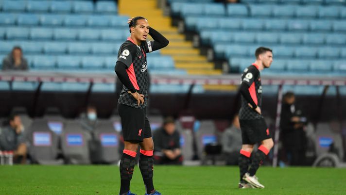 BIRMINGHAM, ENGLAND - OCTOBER 04: Virgil van Dijk of Liverpool reacts after Aston Villa score their 7th goal during the Premier League match between Aston Villa and Liverpool at Villa Park on October 04, 2020 in Birmingham, England. Sporting stadiums around the UK remain under strict restrictions due to the Coronavirus Pandemic as Government social distancing laws prohibit fans inside venues resulting in games being played behind closed doors. (Photo by Peter Powell - Pool/Getty Images) BIRMINGHAM, ENGLAND - OCTOBER 04: Virgil van Dijk of Liverpool reacts after Aston Villa score their 7th goal during the Premier League match between Aston Villa and Liverpool at Villa Park on October 04, 2020 in Birmingham, England. Sporting stadiums around the UK remain under strict restrictions due to the Coronavirus Pandemic as Government social distancing laws prohibit fans inside venues resulting in games being played behind closed doors. (Photo by Peter Powell - Pool/Getty Images)
