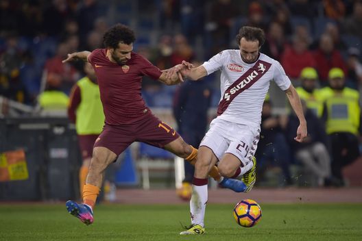 ROME, ITALY - FEBRUARY 19: Mohamed Salah of AS Roma and Emiliano Moretti of FC Torino compete for the ball during the Serie A match between AS Roma and FC Torino at Stadio Olimpico on February 19, 2017 in Rome, Italy. (Photo by Luciano Rossi/AS Roma via Getty Images) ROME, ITALY - FEBRUARY 19: Mohamed Salah of AS Roma and Emiliano Moretti of FC Torino compete for the ball during the Serie A match between AS Roma and FC Torino at Stadio Olimpico on February 19, 2017 in Rome, Italy. (Photo by Luciano Rossi/AS Roma via Getty Images)